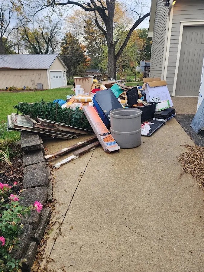 Dumpster being loaded with debris for Residential Dumpster Rental in Friona